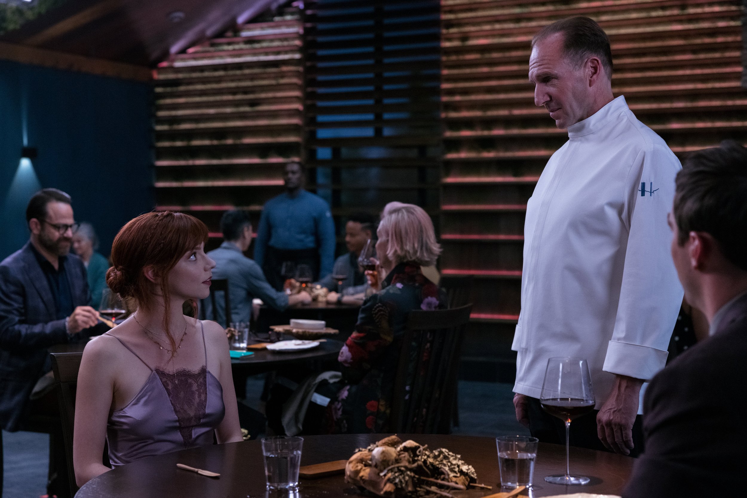 Anya Taylor-Joy and Ralph Fiennes in the film THE MENU. Photo by Eric Zachanowich. Courtesy of Searchlight Pictures. © 2022 20th Century Studios All Rights Reserved